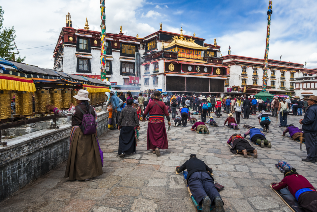 Pilgrims performing the holy Kora at Barkhor Square outside Jokhang Temple, Lhasa