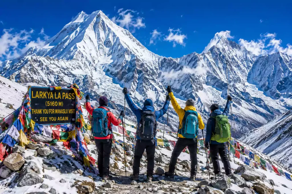 Manaslu Tsum Valley combo trek — trekkers crossing Larkya La Pass 5160m with Manaslu and Himalchuli in background | Nepal Footprint Holiday