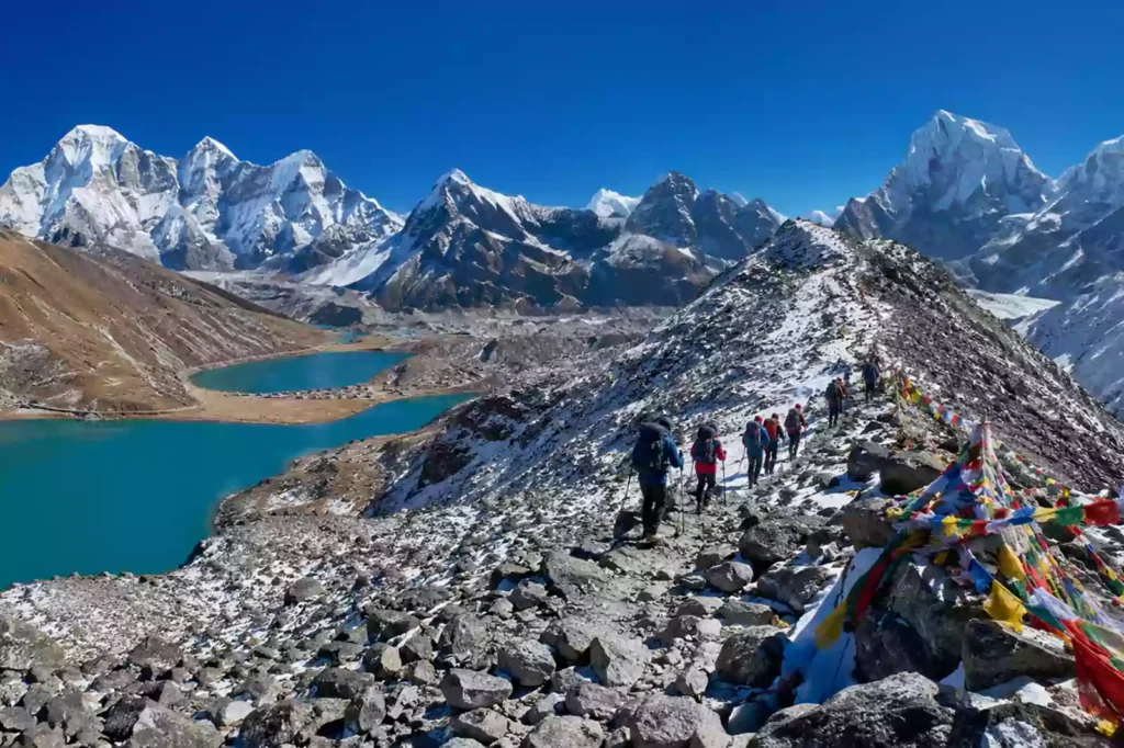 Gokyo Cho La Pass trek complete guide — trekkers crossing Cho La Pass 5420m with Everest and Lhotse visible behind, Khumbu region Nepal | Nepal Footprint Holiday
