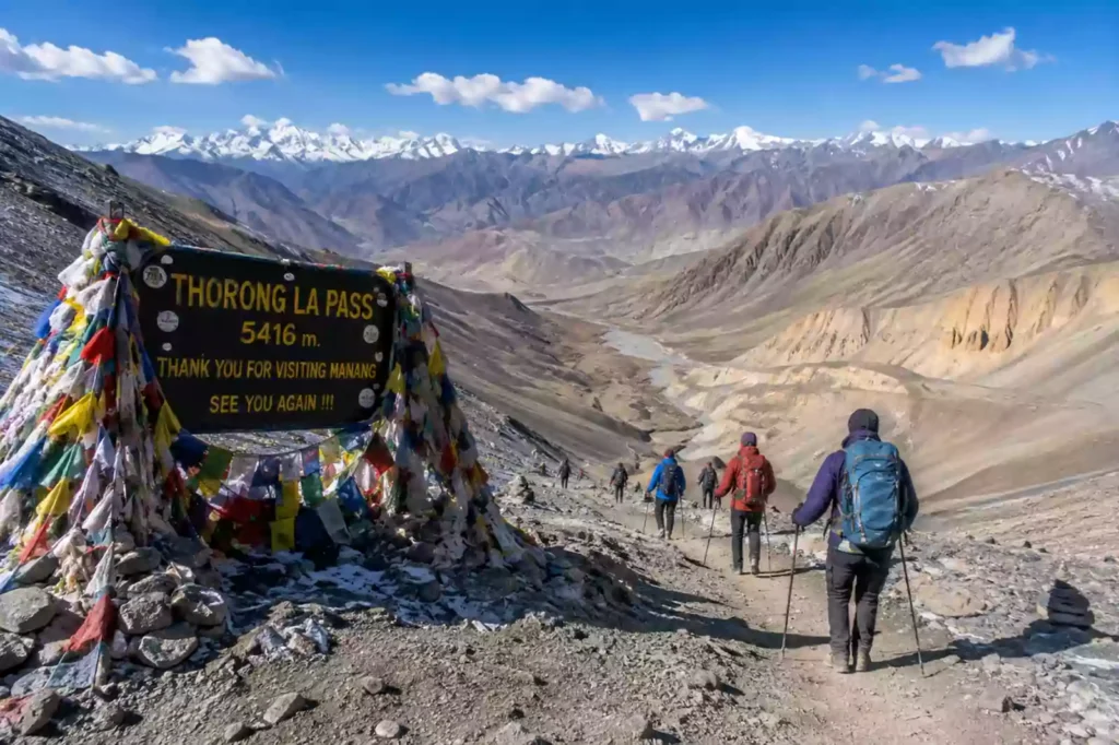 Thorong La Pass crossing guide tips — descent trail from Thorong La Pass 5416m toward Muktinath valley and Mustang plateau, Nepal | Nepal Footprint Holiday