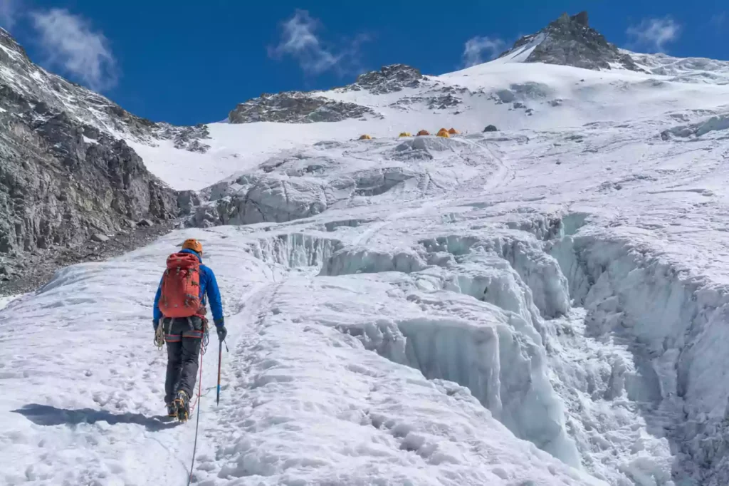 Climber crossing Mera La glacier toward Mera Peak High Camp – Nepal Footprint Holiday