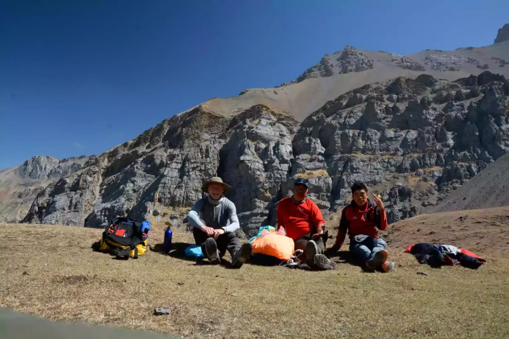 Trekkers and licensed guide resting along the Annapurna Circuit Trek trail with Nepal Footprint Holiday